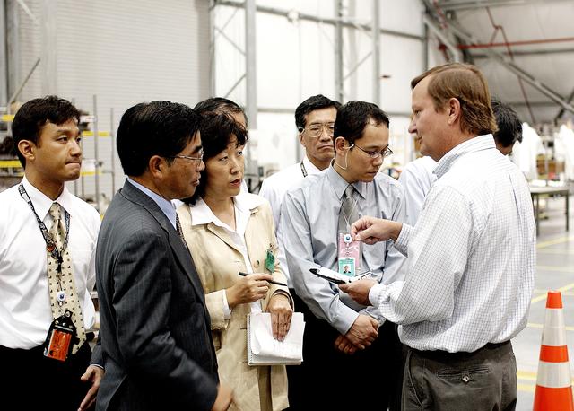 NASA image: KENNEDY SPACE CENTER, FLA. -   Shuttle Launch Director Mike Leinbach (right) explains recovery and reconstruction efforts of Columbia to the Executive Director of NASDA Koji Yamamoto (second from left) and others visiting the Columbia Debris Hangar.   Mr. Yamamoto is at KSC for a welcome ceremony involving the arrival of the newest Space Station module, the Japanese Experiment Module/pressurized module.