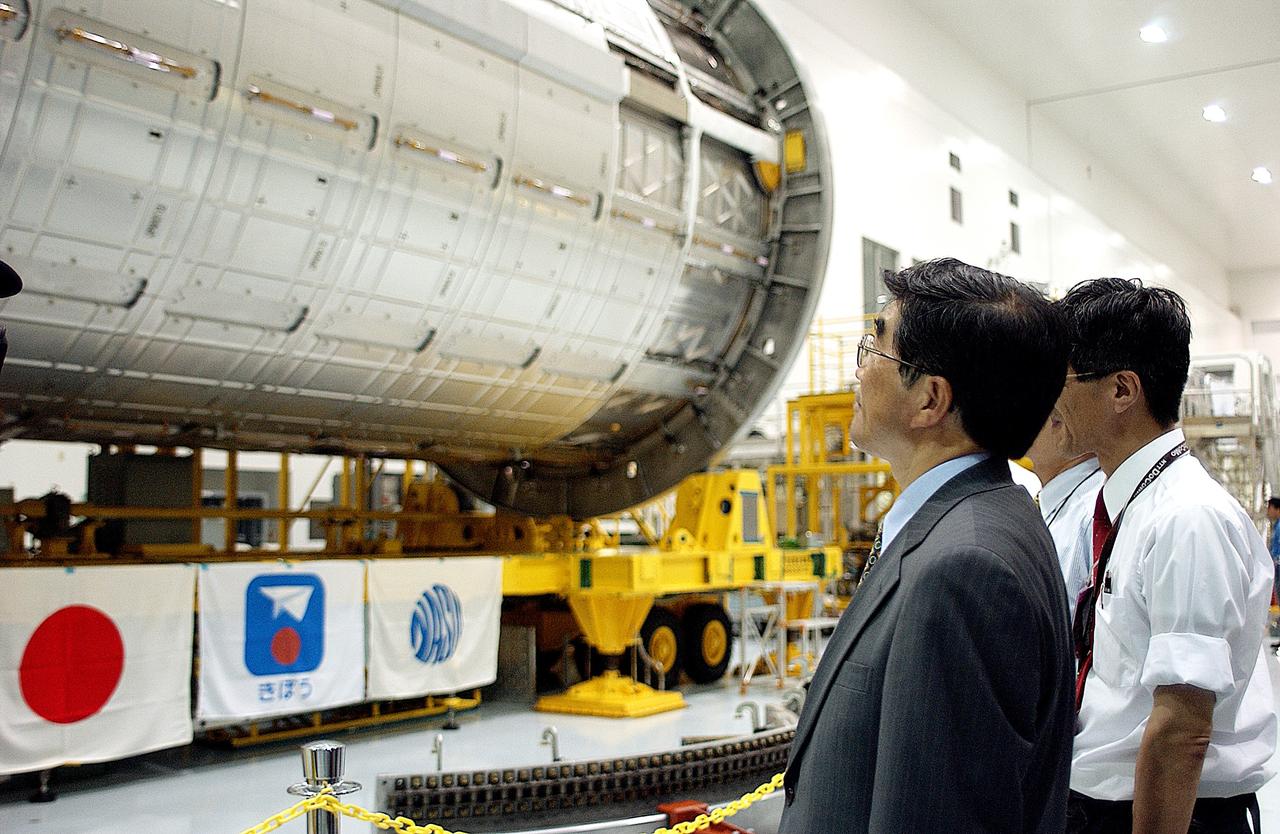 KENNEDY SPACE CENTER, FLA. -  In the Space Station Processing Facility, Executive Director of NASDA Koji Yamamoto (left) looks at the newly arrived Japanese Experiment Module (JEM)/pressurized module.  Mr. Yamamoto is at KSC for a welcome ceremony involving the arrival of JEM.
