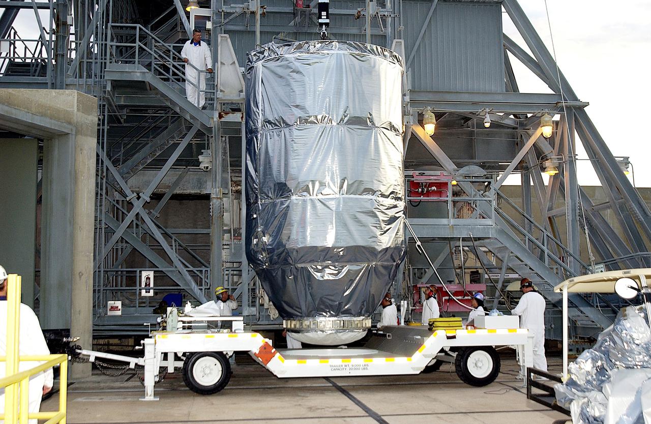 KENNEDY SPACE CENTER, FLA. - The Mars Exploration Rover 1 (MER-B) arrives at Launch Pad 17-B, Cape Canaveral Air Force Station, where it will be mated with the Delta rocket for launch.  The second of twin rovers being sent to Mars, it is equipped with a robotic arm, a drilling tool, three spectrometers, and four pairs of cameras that allow it to have a human-like, 3D view of the terrain. Each rover could travel as far as 100 meters in one day to act as Mars scientists' eyes and hands, exploring an environment where humans can't yet go.  MER-B is scheduled to launch June 26 at one of two available times,  12:27:31 a.m. EDT or 1:08:45 a.m. EDT.