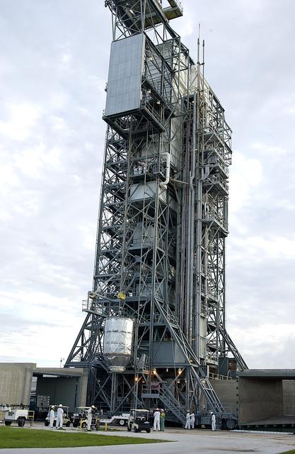 NASA image: KENNEDY SPACE CENTER, FLA. -  On Launch Pad 17-B, Cape Canaveral Air Force Station, the Mars Exploration Rover 1 (MER-B) is lifted up the tower for mating with the Delta rocket.  The second of twin rovers being sent to Mars, it is equipped with a robotic arm, a drilling tool, three spectrometers, and four pairs of cameras that allow it to have a human-like, 3D view of the terrain. Each rover could travel as far as 100 meters in one day to act as Mars scientists' eyes and hands, exploring an environment where humans can't yet go.  MER-B is scheduled to launch June 26 at one of two available times,  12:27:31 a.m. EDT or 1:08:45 a.m. EDT.
