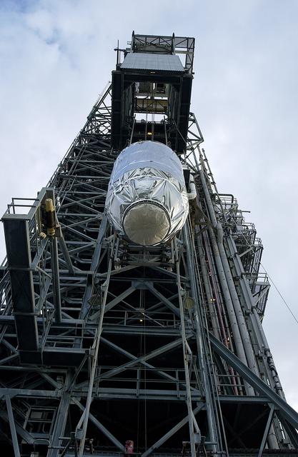 NASA image: KENNEDY SPACE CENTER, FLA. -   On Launch Pad 17-B, Cape Canaveral Air Force Station, the Mars Exploration Rover 1 (MER-B) is lifted up the tower for mating with the Delta rocket.  The second of twin rovers being sent to Mars, it is equipped with a robotic arm, a drilling tool, three spectrometers, and four pairs of cameras that allow it to have a human-like, 3D view of the terrain. Each rover could travel as far as 100 meters in one day to act as Mars scientists' eyes and hands, exploring an environment where humans can't yet go.  MER-B is scheduled to launch June 26 at one of two available times,  12:27:31 a.m. EDT or 1:08:45 a.m. EDT.