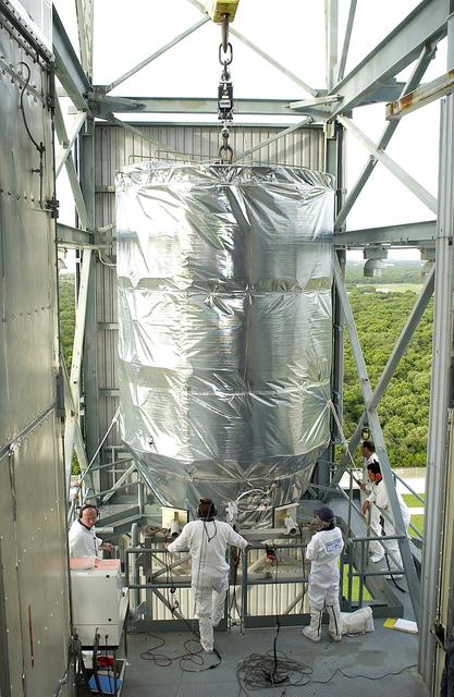 NASA image: KENNEDY SPACE CENTER, FLA. -   On Launch Pad 17-B, Cape Canaveral Air Force Station, the Mars Exploration Rover 1 (MER-B) arrives at the tower landing where it will be mated with the Delta rocket.  The second of twin rovers being sent to Mars, it is equipped with a robotic arm, a drilling tool, three spectrometers, and four pairs of cameras that allow it to have a human-like, 3D view of the terrain. Each rover could travel as far as 100 meters in one day to act as Mars scientists' eyes and hands, exploring an environment where humans can't yet go.  MER-B is scheduled to launch June 26 at one of two available times,  12:27:31 a.m. EDT or 1:08:45 a.m. EDT.