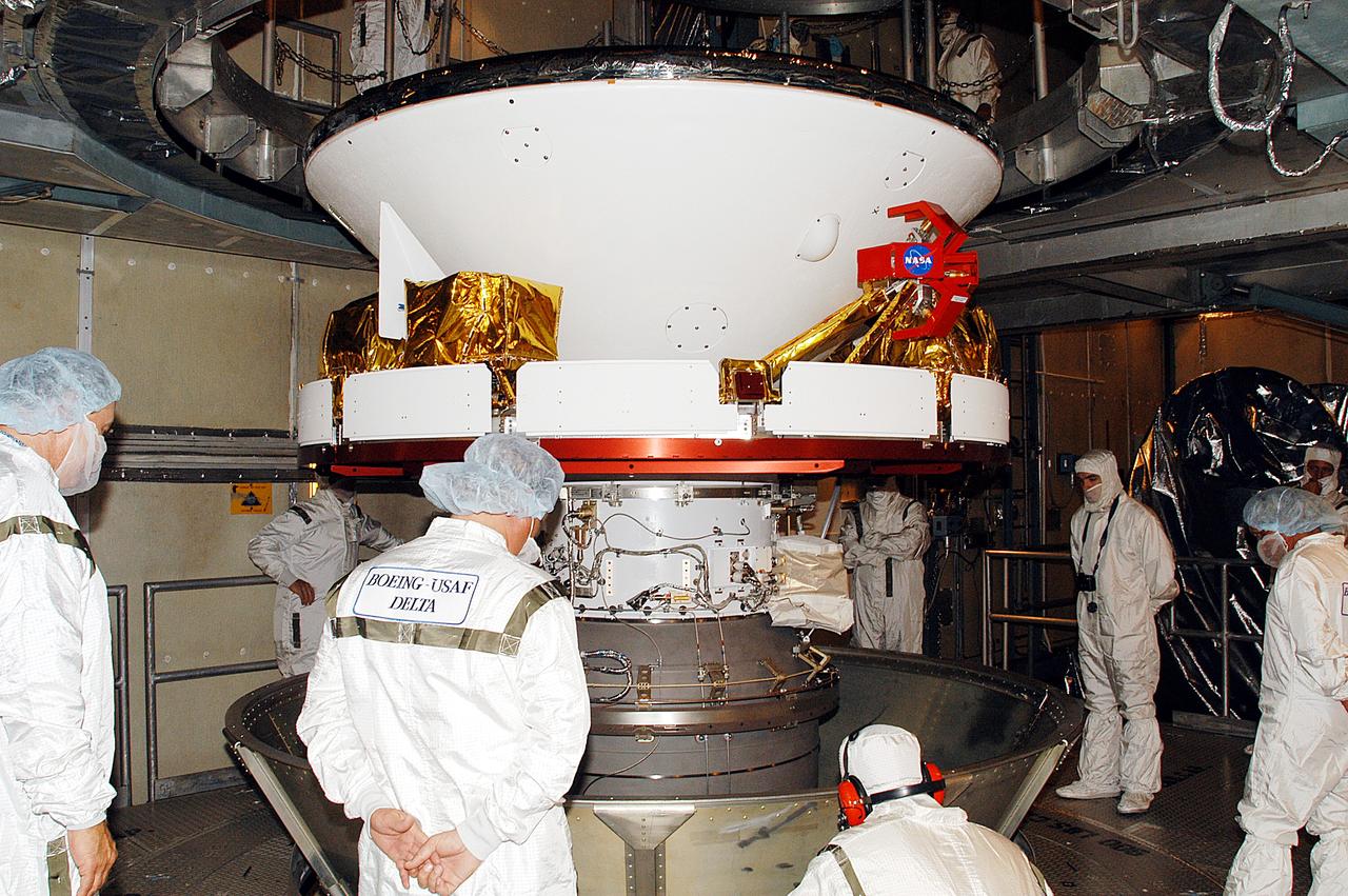KENNEDY SPACE CENTER, FLA. -    In the gantry on Launch Complex 17-B, Cape Canaveral Air Force Station, Mars Exploration Rover 1 (MER-B) is revealed after removal of the canister.  The second of twin rovers being sent to Mars, it is equipped with a robotic arm, a drilling tool, three spectrometers, and four pairs of cameras that allow it to have a human-like, 3D view of the terrain. Each rover could travel as far as 100 meters in one day to act as Mars scientists' eyes and hands, exploring an environment where humans can't yet go.  MER-B is scheduled to launch June 26 at one of two available times,  12:27:31 a.m. EDT or 1:08:45 a.m. EDT.