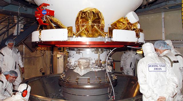NASA image: KENNEDY SPACE CENTER, FLA. -    In the gantry on Launch Complex 17-B, Cape Canaveral Air Force Station, Mars Exploration Rover 1 (MER-B) is revealed after removal of the canister.  The second of twin rovers being sent to Mars, it is equipped with a robotic arm, a drilling tool, three spectrometers, and four pairs of cameras that allow it to have a human-like, 3D view of the terrain. Each rover could travel as far as 100 meters in one day to act as Mars scientists' eyes and hands, exploring an environment where humans can't yet go.  MER-B is scheduled to launch June 26 at one of two available times,  12:27:31 a.m. EDT or 1:08:45 a.m. EDT.