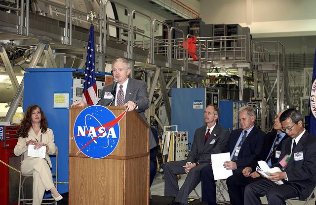 NASA image: KENNEDY SPACE CENTER, FLA. -  Center Director Roy Bridges Jr. speaks to the media and guests gathered in the Space Station Processing Facility for a ceremony to highlight the arrival of two major components of the International Space Station.  NASA's Node 2, built by the European Space Agency (ESA) in Italy arrived at KSC on June 1. It will be the next pressurized module installed on the Station. The pressurized module of the Japanese Experiment Module (JEM), named "Kibo" (Hope) arrived at KSC on June 4. It is Japan's primary contribution to the Station. The ceremony held today included the official transfer of ownership signing of Node 2 between the ESA and NASA.. Emceed by Lisa Malone (left) ,  deputy director of External Relations and Business Development at KSC, the ceremony also included these speakers: NASA's Michael C. Kostelnik, deputy associate administrator for International Space Station and Shuttle Programs, and William Gerstenmaier, International Space Station Program manager; Alan Thirkettle, International Space Station Program manager for Node 2, ESA; Andrea Lorenzoni, International Space Station Program manager for Node 2, Italian Space Agency; Kuniaki Shiraki, JEM Project manager, National Aerospace and Development Agency of Japan.
