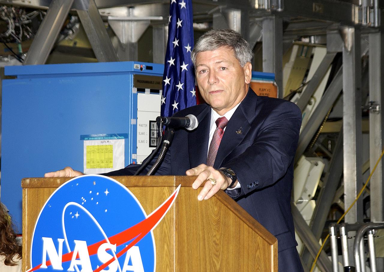 KENNEDY SPACE CENTER, FLA. -   NASA’s Michael C. Kostelnik, deputy associate administrator for International Space Station and Shuttle Programs, speaks to guests and the media gathered in the Space Station Processing Facility for a ceremony to highlight the arrival of two major components of the International Space Station.  NASA's Node 2, built by the European Space Agency (ESA) in Italy arrived at KSC on June 1. It will be the next pressurized module installed on the Station. The pressurized module of the Japanese Experiment Module (JEM), named "Kibo" (Hope) arrived at KSC on June 4. It is Japan's primary contribution to the Station. The ceremony held today included the official transfer of ownership signing of Node 2 between the ESA and NASA.. Emceed by Lisa Malone, deputy director of External Relations and Business Development at KSC, the ceremony also included these speakers: Center Director Roy Bridges Jr.; William Gerstenmaier, International Space Station Program manager; Alan Thirkettle, International Space Station Program manager for Node 2, ESA; Andrea Lorenzoni, International Space Station Program manager for Node 2, Italian Space Agency; and Kuniaki Shiraki, JEM Project manager, National Aerospace and Development Agency of Japan.