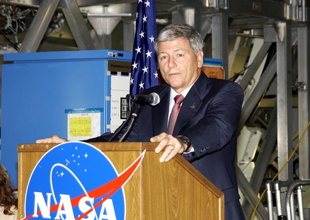 NASA image: KENNEDY SPACE CENTER, FLA. -   NASA’s Michael C. Kostelnik, deputy associate administrator for International Space Station and Shuttle Programs, speaks to guests and the media gathered in the Space Station Processing Facility for a ceremony to highlight the arrival of two major components of the International Space Station.  NASA's Node 2, built by the European Space Agency (ESA) in Italy arrived at KSC on June 1. It will be the next pressurized module installed on the Station. The pressurized module of the Japanese Experiment Module (JEM), named "Kibo" (Hope) arrived at KSC on June 4. It is Japan's primary contribution to the Station. The ceremony held today included the official transfer of ownership signing of Node 2 between the ESA and NASA.. Emceed by Lisa Malone, deputy director of External Relations and Business Development at KSC, the ceremony also included these speakers: Center Director Roy Bridges Jr.; William Gerstenmaier, International Space Station Program manager; Alan Thirkettle, International Space Station Program manager for Node 2, ESA; Andrea Lorenzoni, International Space Station Program manager for Node 2, Italian Space Agency; and Kuniaki Shiraki, JEM Project manager, National Aerospace and Development Agency of Japan.
