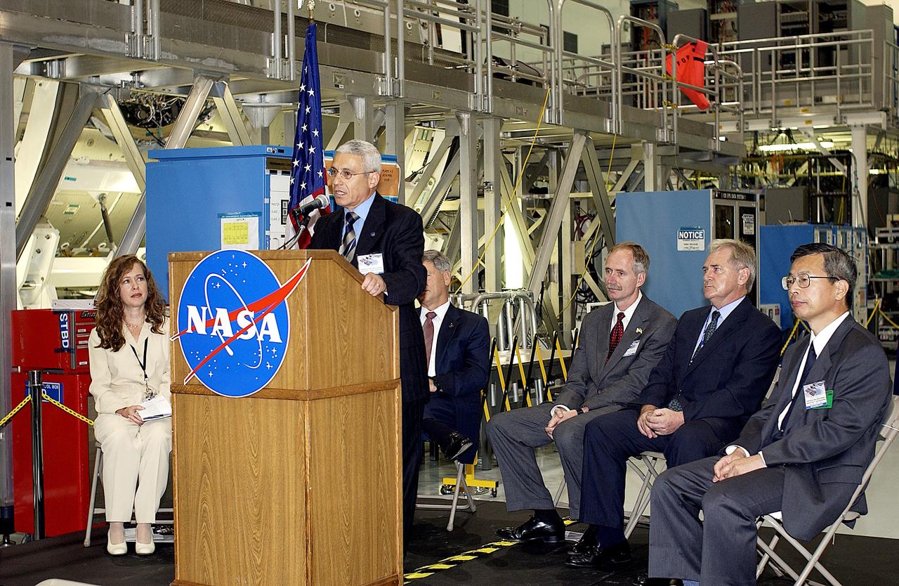 KENNEDY SPACE CENTER, FLA. -   Andrea Lorenzoni, International Space Station Program manager for Node 2, Italian Space Agency, speaks to guests and the media gathered in the Space Station Processing Facility at a ceremony highlighting the arrival of two major components of the International Space Station.  NASA's Node 2, built by the European Space Agency (ESA) in Italy, arrived at KSC on June 1. It will be the next pressurized module installed on the Station. The pressurized module of the Japanese Experiment Module (JEM), named "Kibo" (Hope), arrived at KSC on June 4. It is Japan's primary contribution to the Station. The ceremony held today included the official transfer of ownership signing of Node 2 between the ESA and NASA.. Emceed by Lisa Malone (far left), deputy director of External Relations and Business Development at KSC, the ceremony also included these speakers: Center Director Roy Bridges Jr.; NASA’s Michael C. Kostelnik, deputy associate administrator for International Space Station and Shuttle Programs, and William Gerstenmaier, International Space Station Program manager ; Alan Thirkettle, International Space Station Program manager for Node 2, ESA; and Kuniaki Shiraki, JEM Project manager, National Aerospace and Development Agency of Japan.