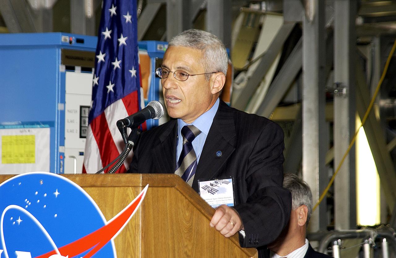 KENNEDY SPACE CENTER, FLA. -  Andrea Lorenzoni, International Space Station Program manager for Node 2, Italian Space Agency, speaks to guests and the media gathered in the Space Station Processing Facility at a ceremony highlighting the arrival of two major components of the International Space Station.  NASA's Node 2, built by the European Space Agency (ESA) in Italy, arrived at KSC on June 1. It will be the next pressurized module installed on the Station. The pressurized module of the Japanese Experiment Module (JEM), named "Kibo" (Hope), arrived at KSC on June 4. It is Japan's primary contribution to the Station. The ceremony held today included the official transfer of ownership signing of Node 2 between the ESA and NASA.. Emceed by Lisa Malone, deputy director of External Relations and Business Development at KSC, the ceremony also included these speakers: Center Director Roy Bridges Jr.; NASA’s Michael C. Kostelnik, deputy associate administrator for International Space Station and Shuttle Programs and William Gerstenmaier, International Space Station Program manager; Alan Thirkettle, International Space Station Program manager for Node 2, ESA; and Kuniaki Shiraki, JEM Project manager, National Aerospace and Development Agency of Japan.