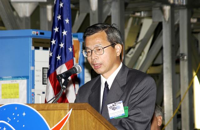NASA image: KENNEDY SPACE CENTER, FLA. -  Kuniaki Shiraki, JEM Project manager, National Aerospace and Development Agency of Japan,  speaks to guests and the media gathered in the Space Station Processing Facility at a ceremony highlighting the arrival of two major components of the International Space Station.  NASA's Node 2, built by the European Space Agency (ESA) in Italy, arrived at KSC on June 1. It will be the next pressurized module installed on the Station. The pressurized module of the Japanese Experiment Module (JEM), named "Kibo" (Hope), arrived at KSC on June 4. It is Japan's primary contribution to the Station. The ceremony held today included the official transfer of ownership signing of Node 2 between the ESA and NASA.. Emceed by Lisa Malone, deputy director of External Relations and Business Development at KSC, the ceremony also included these speakers: Center Director Roy Bridges Jr.; NASA’s Michael C. Kostelnik, deputy associate administrator for International Space Station and Shuttle Programs and William Gerstenmaier, International Space Station Program manager ; Alan Thirkettle, International Space Station Program manager for Node 2, ESA; and Andrea Lorenzoni, International Space Station Program manager for Node 2, Italian Space Agency.
