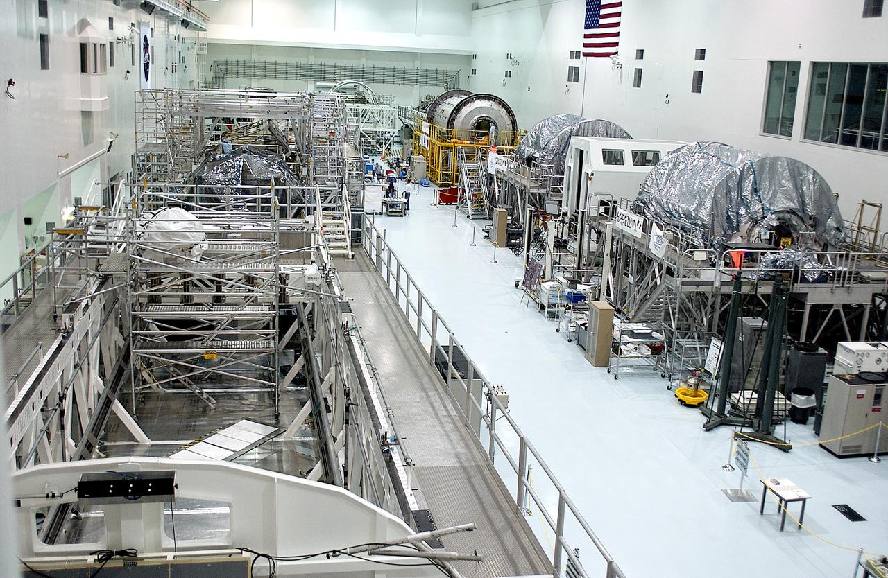 KENNEDY SPACE CENTER, FLA. -  International Space Station elements being processed for launch on upcoming Space Shuttle flights line the walls of the high bay in the Space Station Processing Facility. NASA's Node 2, built by the European Space Agency (ESA) in Italy, arrived at KSC on June 1. It will be the next pressurized module installed on the Station. The pressurized module of the Japanese Experiment Module (JEM), named "Kibo" (Hope), arrived at KSC on June 4. It is Japan's primary contribution to the Station.