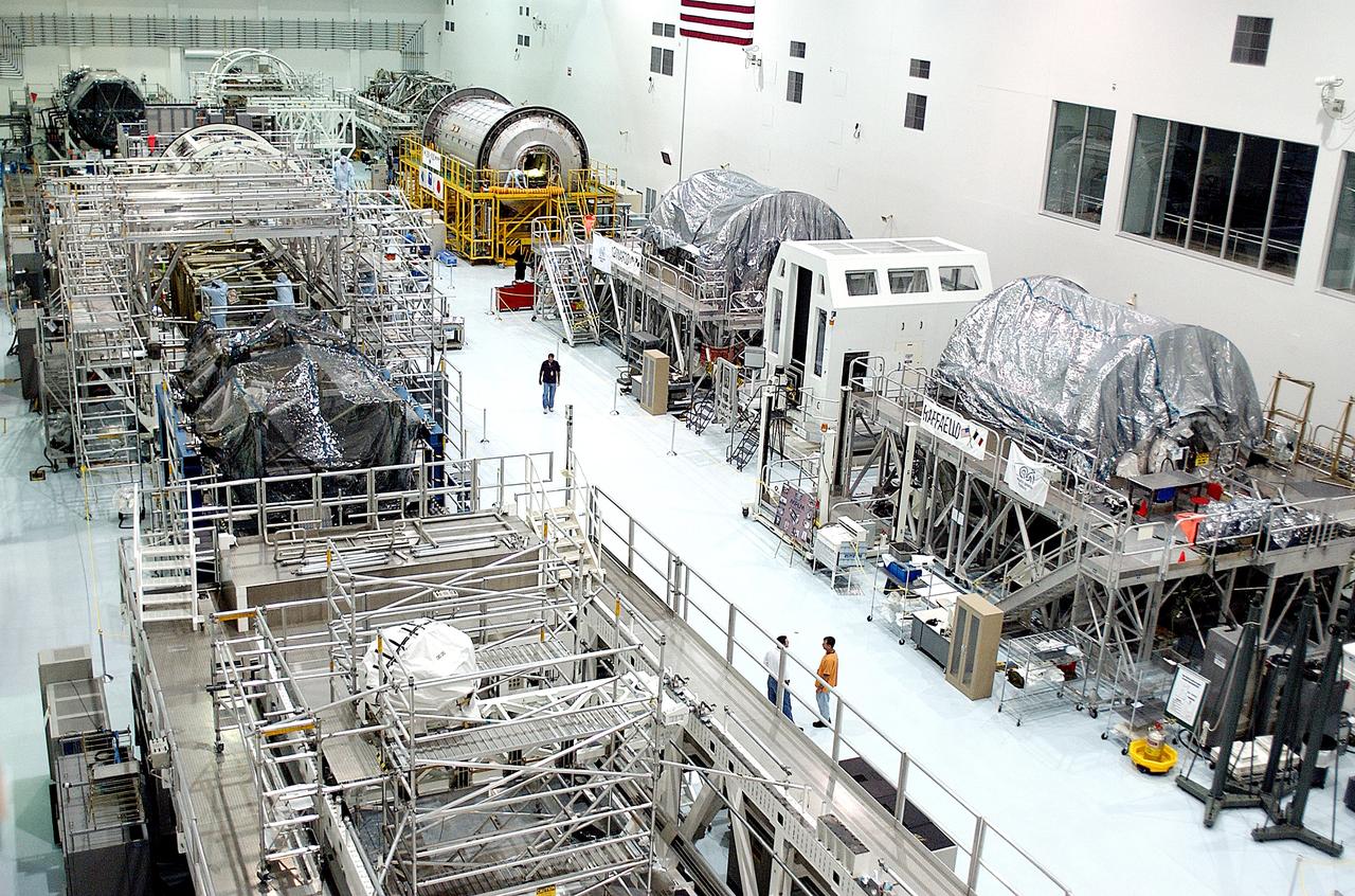 KENNEDY SPACE CENTER, FLA. -  International Space Station elements being processed for launch on upcoming Space Shuttle flights line the walls of the high bay in the Space Station Processing Facility. NASA's Node 2, built by the European Space Agency (ESA) in Italy, arrived at KSC on June 1. It will be the next pressurized module installed on the Station. The pressurized module of the Japanese Experiment Module (JEM), named "Kibo" (Hope), arrived at KSC on June 4. It is Japan's primary contribution to the Station.