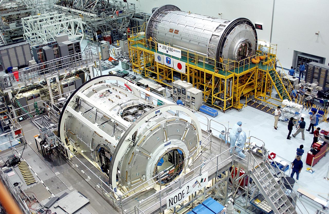 KENNEDY SPACE CENTER, FLA. -  International Space Station elements being processed for launch on upcoming Space Shuttle flights, including the U.S. Node 2 and the Japanese Experiment Module (JEM) pressurized module, line the walls of the high bay in the Space Station Processing Facility. NASA's Node 2, built by the European Space Agency (ESA) in Italy, arrived at KSC on June 1. It will be the next pressurized module installed on the Station. The JEM pressurized module, named "Kibo" (Hope), arrived at KSC on June 4. It is Japan's primary contribution to the Station.