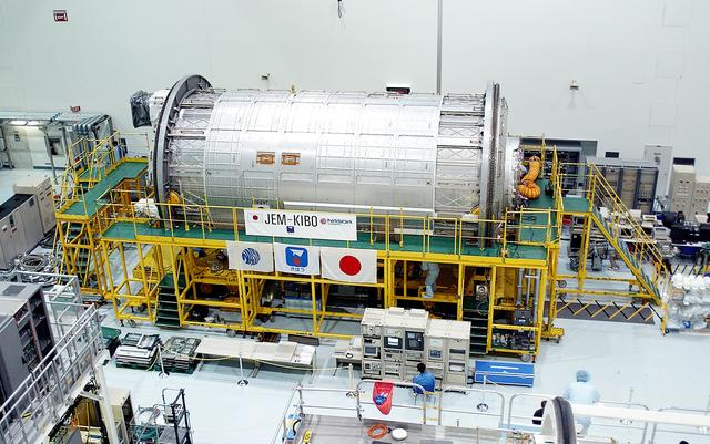 NASA image: KENNEDY SPACE CENTER, FLA. -  International Space Station elements being processed for launch on upcoming Space Shuttle flights, including the Japanese Experiment Module (JEM) pressurized module, line the walls of the high bay in the Space Station Processing Facility. The JEM pressurized module, named "Kibo" (Hope), arrived at KSC on June 4. It is Japan's primary contribution to the Station.