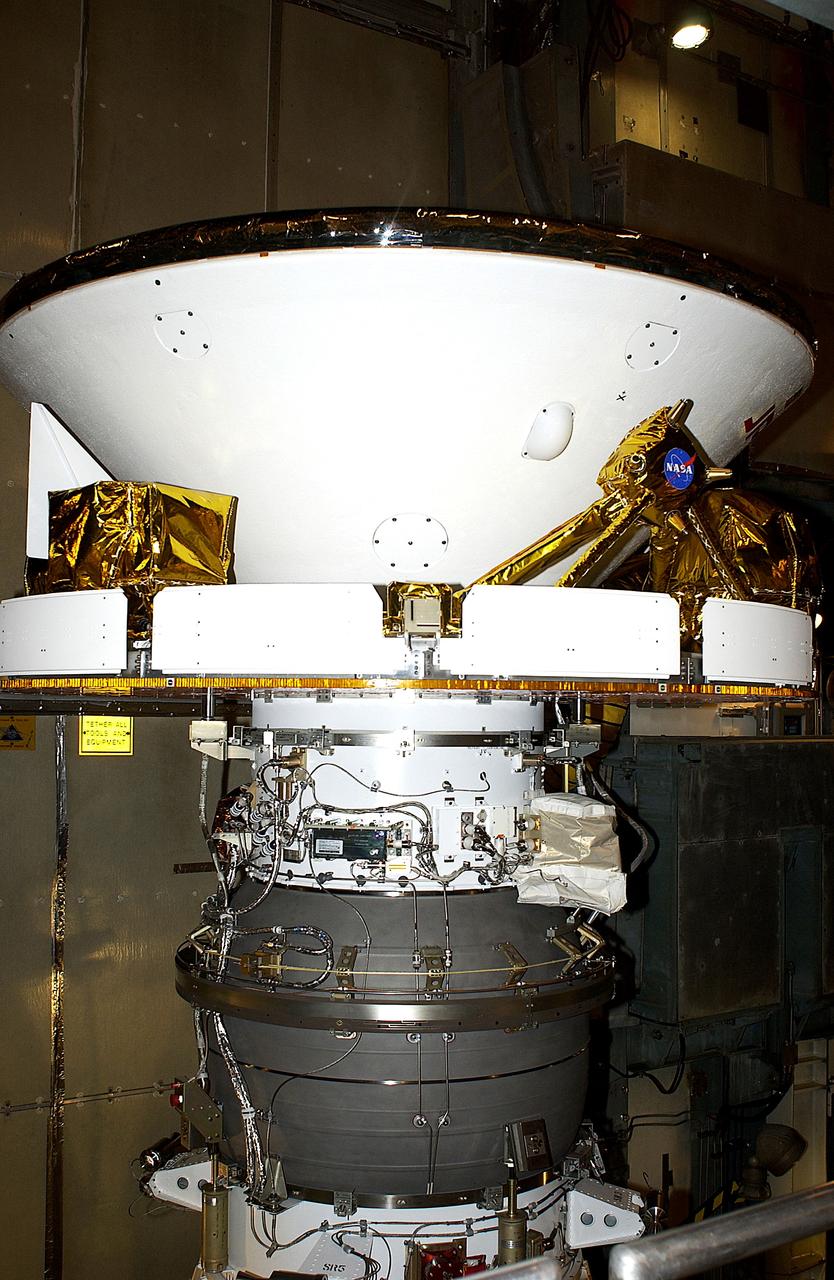 KENNEDY SPACE CENTER, FLA. - At Launch Complex 17-B, Cape Canaveral Air Force Station, Mars Exploration Rover-1 (MER-B) is prepared for the installation of its spacecraft fairing. The second of twin rovers being sent to Mars, it is equipped with a robotic arm, a drilling tool, three spectrometers, and four pairs of cameras that allow it to have a human-like, 3D view of the terrain. Each rover could travel as far as 100 meters in one day to act as Mars scientists' eyes and hands, exploring an environment where humans are not yet able to go. MER-B is scheduled to launch no earlier than June 28 at one of two available times, 11:56:16 p.m. EDT or 12:37:59 a.m. EDT.