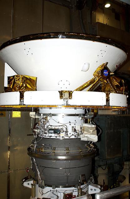 NASA image: KENNEDY SPACE CENTER, FLA. - At Launch Complex 17-B, Cape Canaveral Air Force Station, Mars Exploration Rover-1 (MER-B) is prepared for the installation of its spacecraft fairing. The second of twin rovers being sent to Mars, it is equipped with a robotic arm, a drilling tool, three spectrometers, and four pairs of cameras that allow it to have a human-like, 3D view of the terrain. Each rover could travel as far as 100 meters in one day to act as Mars scientists' eyes and hands, exploring an environment where humans are not yet able to go. MER-B is scheduled to launch no earlier than June 28 at one of two available times, 11:56:16 p.m. EDT or 12:37:59 a.m. EDT.