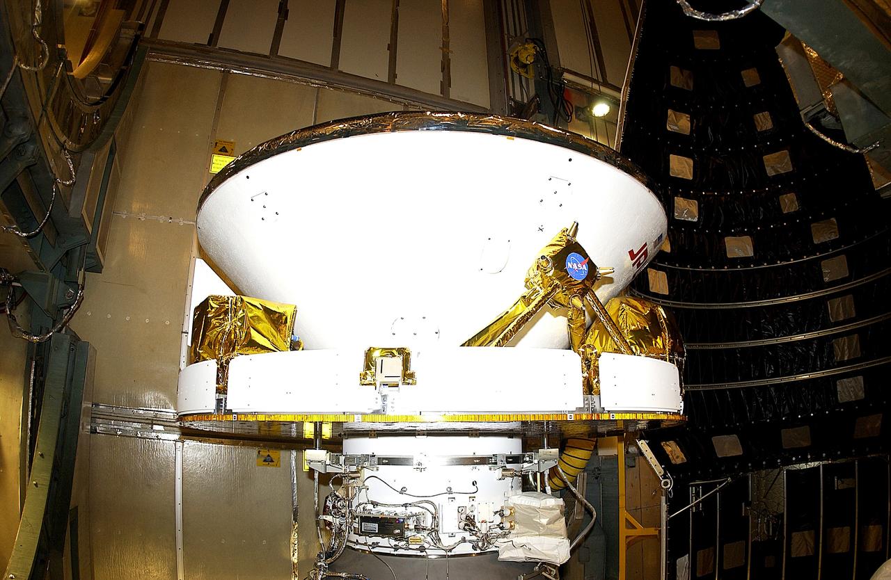 KENNEDY SPACE CENTER, FLA. - At Launch Complex 17-B, Cape Canaveral Air Force Station, Mars Exploration Rover-1 (MER-B) "Opportunity" awaits installation of its spacecraft fairing. The second of twin rovers being sent to Mars, it is equipped with a robotic arm, a drilling tool, three spectrometers, and four pairs of cameras that allow it to have a human-like, 3D view of the terrain. Each rover could travel as far as 100 meters in one day to act as Mars scientists' eyes and hands, exploring an environment where humans are not yet able to go. MER-B is scheduled to launch no earlier than June 28 at one of two available times, 11:56:16 p.m. EDT or 12:37:59 a.m. EDT.