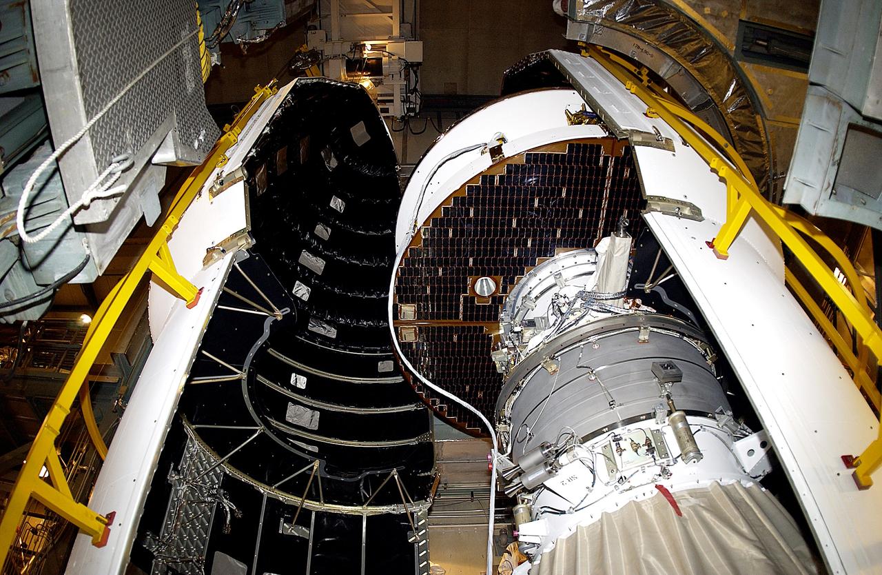 KENNEDY SPACE CENTER, FLA. - At Launch Complex 17-B, Cape Canaveral Air Force Station, a final view of the Mars Exploration Rover-1 (MER-B) is captured before it is encapsulated into its spacecraft fairing for launch. The second of twin rovers being sent to Mars, it is equipped with a robotic arm, a drilling tool, three spectrometers, and four pairs of cameras that allow it to have a human-like, 3D view of the terrain. Each rover could travel as far as 100 meters in one day to act as Mars scientists' eyes and hands, exploring an environment where humans are not yet able to go. MER-B is scheduled to launch no earlier than June 28 at one of two available times, 11:56:16 p.m. EDT or 12:37:59 a.m. EDT.
