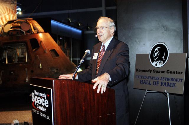 NASA image: KENNEDY SPACE CENTER, FLA. -  Former astronaut James Lovell addresses the audience at a ribbon cutting ceremony officially opening the U.S. Astronaut Hall of Fame as part of the Kennedy Space Center Visitor Complex.  The ceremony was held in conjunction with the induction of four Space Shuttle astronauts into the Hall of Fame including Daniel Brandenstein, Robert "Hoot" Gibson, Story Musgrave, and Sally Ride.  Conceived by six of the Mercury Program astronauts, the U.S. Astronaut Hall of Fame opened in 1990 to provide a place where space travelers could be remembered for their participation and accomplishments in the U.S. space program.  The four new inductees join 48 previously honored astronauts from the ranks of the Gemini, Apollo, Skylab, Apollo-Soyuz, and Space Shuttle programs.