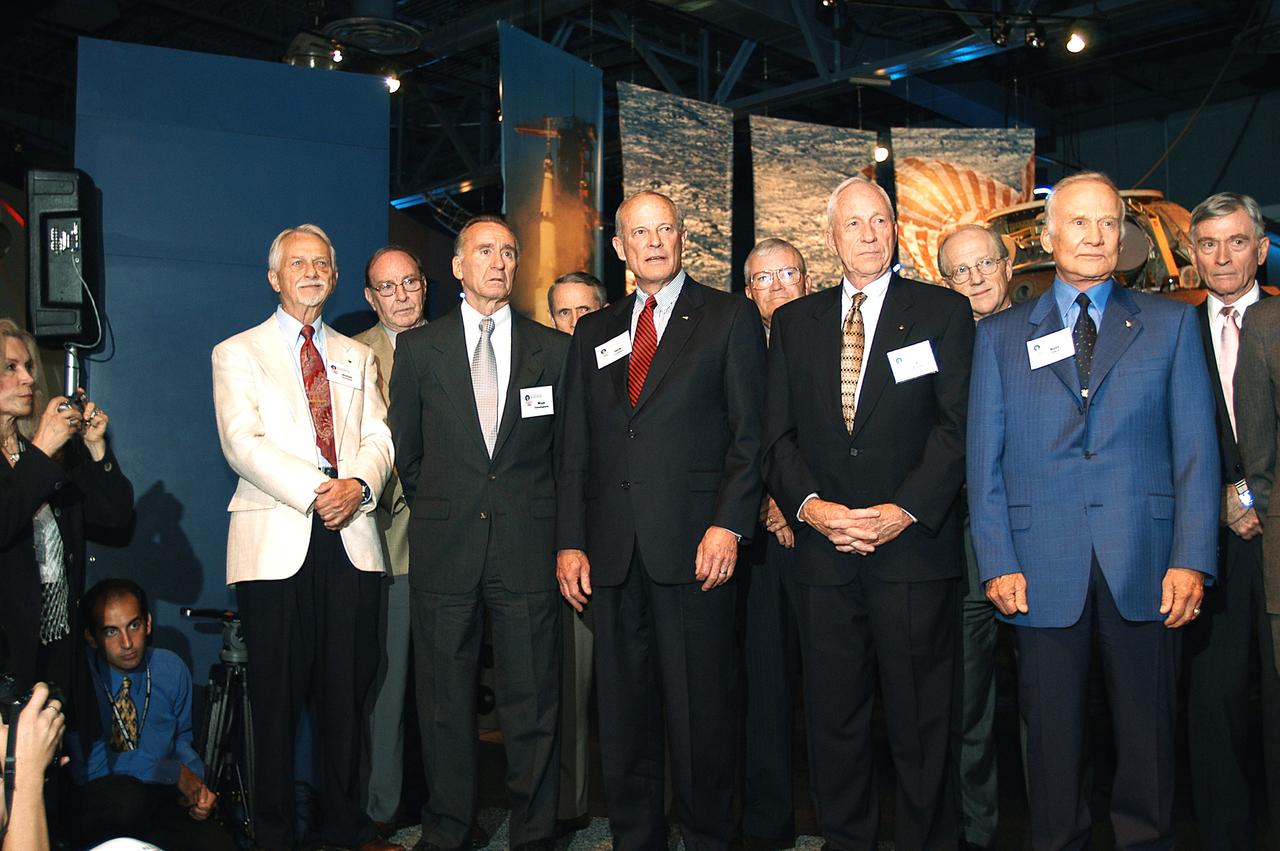 KENNEDY SPACE CENTER, FLA. -  A group of current and former U.S. astronauts are introduced to the audience at a ribbon cutting ceremony officially opening the U.S. Astronaut Hall of Fame as part of the Kennedy Space Center Visitor Complex.  In the front row, from left, are Owen K. Garriott, Walter Cunningham, Jack R. Lousma, Alfred M. Worden, and Buzz Aldrin.  In the back row, from left, are Edgar D. Mitchell, Edward G. Gibson, Fred W. Haise, Frederick H. (Rick) Hauck, and John W. Young.  The ceremony was held in conjunction with the induction of four Space Shuttle astronauts into the Hall of Fame including Daniel Brandenstein, Robert "Hoot" Gibson, Story Musgrave, and Sally Ride.  Conceived by six of the Mercury Program astronauts, the U.S. Astronaut Hall of Fame opened in 1990 to provide a place where space travelers could be remembered for their participation and accomplishments in the U.S. space program.  The four new inductees join 48 previously honored astronauts from the ranks of the Gemini, Apollo, Skylab, Apollo-Soyuz, and Space Shuttle programs.
