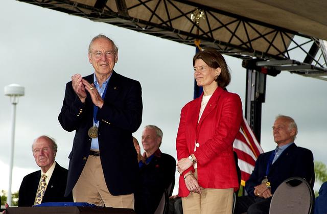 NASA image: KENNEDY SPACE CENTER, FLA. -  At the KSC Visitor Complex, former astronaut James A. Lovell (standing left) applauds former astronaut Sally K. Ride at her induction ceremony into the U.S. Astronaut Hall of Fame. Seated on the dais, from left, are former astronauts Gordon Cooper, Scott Carpenter, and  Buzz Aldrin, all previously inducted into the Hall of Fame. Being inducted with Ride are Space Shuttle astronauts Daniel Brandenstein, Robert "Hoot" Gibson, and Story Musgrave. Conceived by six of the Mercury Program astronauts, the U.S. Astronaut Hall of Fame opened in 1990 to provide a place where space travelers could be remembered for their participation and accomplishments in the U.S. space program. The four new inductees join 48 previously honored astronauts from the ranks of the Gemini, Apollo, Skylab, Apollo-Soyuz, and Space Shuttle programs.