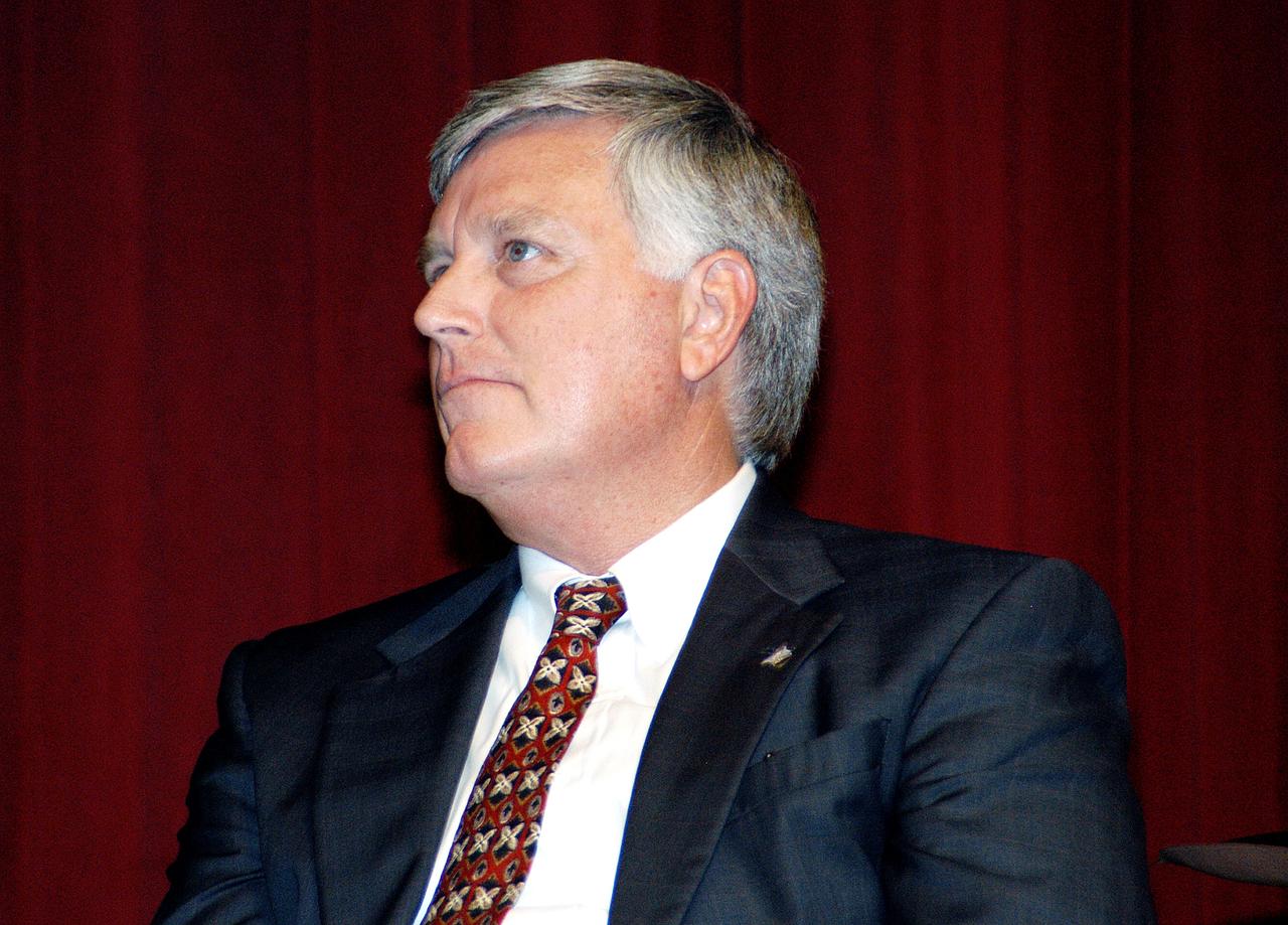 KENNEDY SPACE CENTER, FLA. -  KSC Deputy Director James W. Kennedy receives the news of his appointment as the next director of the NASA Kennedy Space Center (KSC) before a group of KSC employees assembled in the KSC Training Auditorium. Kennedy has served as KSC's deputy director since November 2002. He will succeed KSC Director Roy D. Bridges, who was appointed on June 13 to lead NASA's Langley Research Center, Hampton, Va.