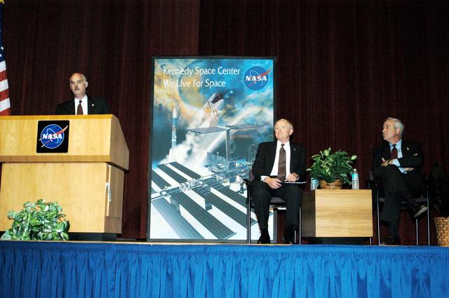 NASA image: KENNEDY SPACE CENTER, FLA. -  NASA Associate Administrator for Space Flight William F. Readdy addresses a group of KSC employees assembled in the KSC Training Auditorium. From left are Readdy, KSC Center Director Roy D. Bridges, and NASA Administrator Sean O'Keefe. The occasion is the announcement of James W. Kennedy as the next director of the NASA Kennedy Space Center (KSC) in Florida. Kennedy has served as KSC's deputy director since November 2002. He will succeed Bridges, who was appointed on June 13 to lead NASA's Langley Research Center, Hampton, Va.