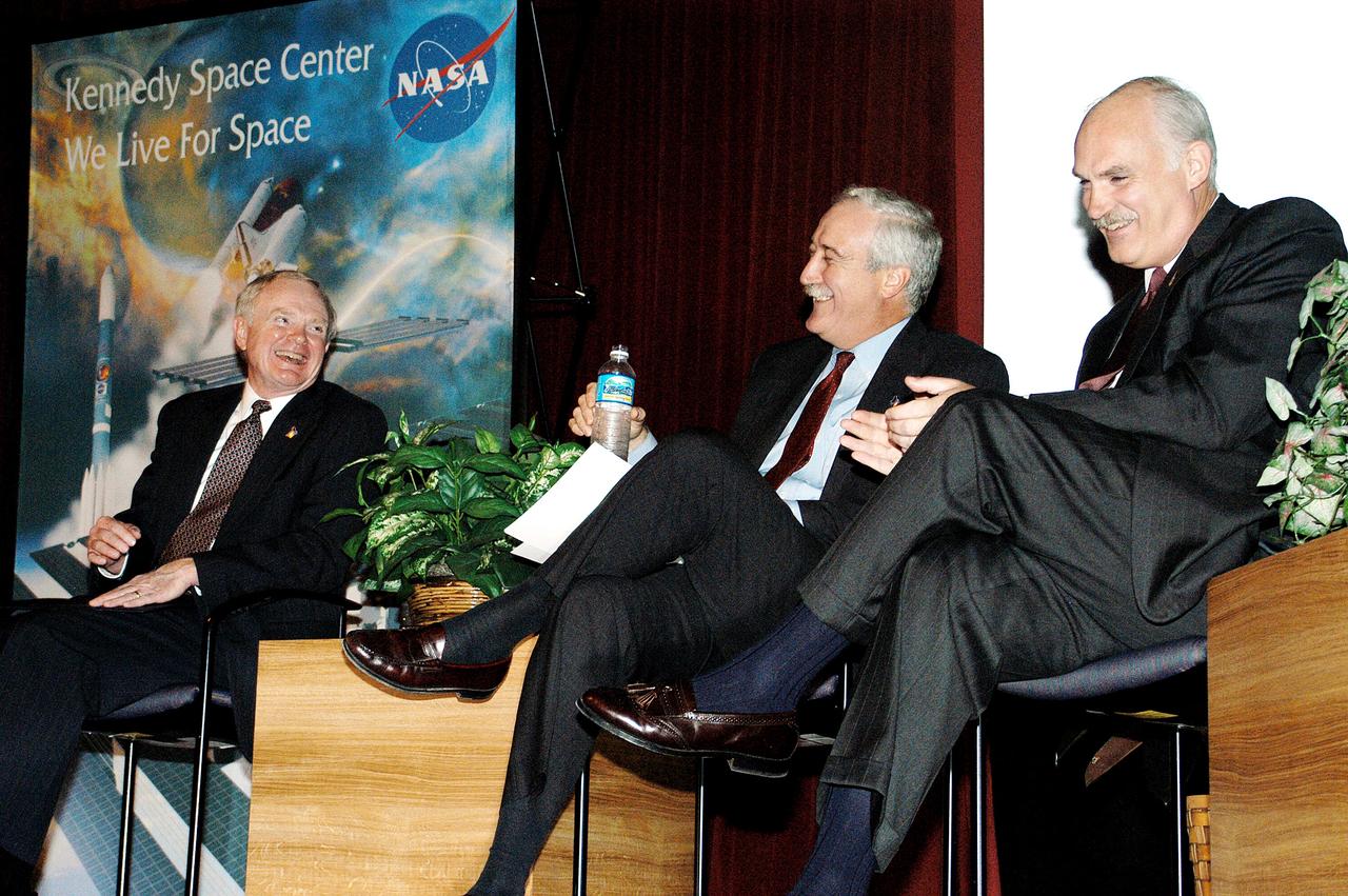 KENNEDY SPACE CENTER, FLA. -  From left, KSC Director Roy D. Bridges, NASA Administrator Sean O'Keefe, and NASA Associate Administrator of Space Flight William F. Readdy share a light moment on the stage in the KSC Training Auditorium. The occasion is the announcement of James W. Kennedy as the next director of the NASA Kennedy Space Center (KSC) in Florida. Kennedy has served as KSC's deputy director since November 2002. He will succeed Bridges, who was appointed on June 13 to lead NASA's Langley Research Center, Hampton, Va.