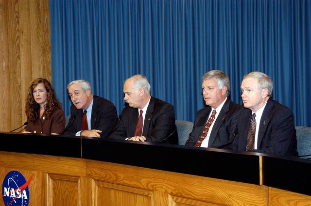 NASA image: KENNEDY SPACE CENTER, FLA. -  NASA officials participate in a press conference in KSC's Press Site Auditorium.  From left are KSC Deputy Director of External Relations and Business Development Lisa Malone, NASA Administrator Sean O'Keefe, NASA Associate Administrator for Space Flight William F. Readdy, KSC Deputy Director James W. Kennedy, and KSC Director Roy D. Bridges. The press conference followed the official announcement of James W. Kennedy as the next director of the NASA Kennedy Space Center (KSC) in Florida. Kennedy has served as KSC's deputy director since November 2002. He will succeed Bridges, who was appointed on June 13 to lead NASA's Langley Research Center, Hampton, Va.