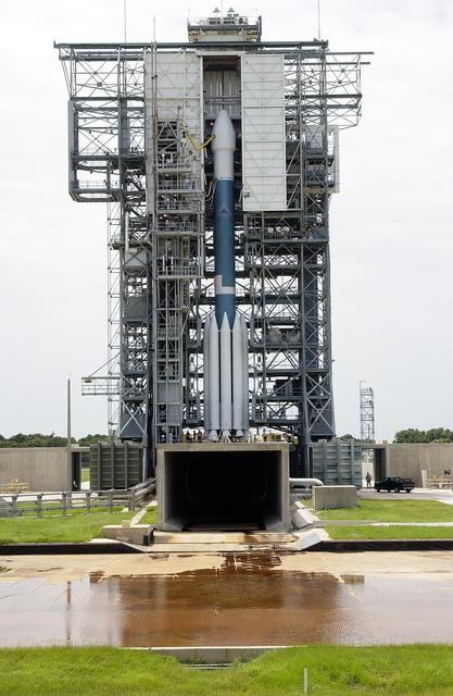 NASA image: KENNEDY SPACE CENTER, FLA. -  The Mobile Service Tower is rolled back at Space Launch Complex 17B, Cape Canaveral Air Force Station, to reveal the Delta II Heavy launch vehicle ready for launch of the Mars Exploration Rover-B (MER-B) mission, with the rover "Opportunity" aboard. The second of twin rovers being sent to Mars, it is equipped with a robotic arm, a drilling tool, three spectrometers, and four pairs of cameras that allow it to have a human-like, 3D view of the terrain. Each rover could travel as far as 100 meters in one day to act as Mars scientists' eyes and hands, exploring an environment where humans are not yet able to go. MER-B is scheduled to launch on June 28 at one of two available times, 11:56:16 p.m. EDT or 12:37:59 a.m. EDT on June 29.