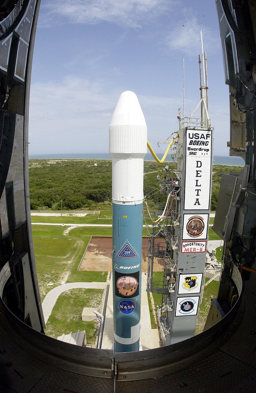 KENNEDY SPACE CENTER, FLA. -  The Mobile Service Tower is rolled back at Space Launch Complex 17B, Cape Canaveral Air Force Station, to reveal the Delta II Heavy launch vehicle ready for launch of the Mars Exploration Rover-B (MER-B) mission, with the rover "Opportunity" aboard. The second of twin rovers being sent to Mars, it is equipped with a robotic arm, a drilling tool, three spectrometers, and four pairs of cameras that allow it to have a human-like, 3D view of the terrain. Each rover could travel as far as 100 meters in one day to act as Mars scientists' eyes and hands, exploring an environment where humans are not yet able to go. MER-B is scheduled to launch on June 28 at one of two available times, 11:56:16 p.m. EDT or 12:37:59 a.m. EDT on June 29.