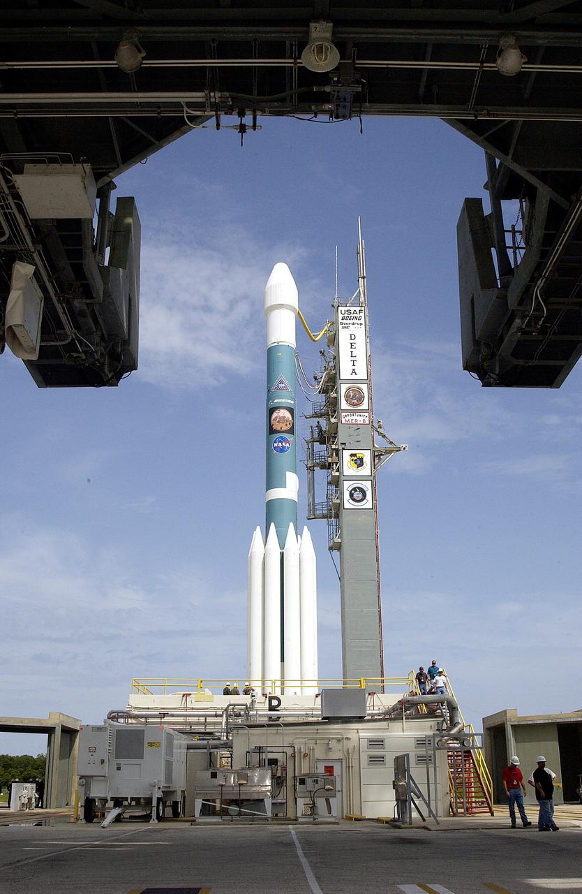 KENNEDY SPACE CENTER, FLA. -  The Mobile Service Tower is rolled back at Space Launch Complex 17B, Cape Canaveral Air Force Station, to reveal the Delta II Heavy launch vehicle ready for launch of the Mars Exploration Rover-B (MER-B) mission, with the rover "Opportunity" aboard. The second of twin rovers being sent to Mars, it is equipped with a robotic arm, a drilling tool, three spectrometers, and four pairs of cameras that allow it to have a human-like, 3D view of the terrain. Each rover could travel as far as 100 meters in one day to act as Mars scientists' eyes and hands, exploring an environment where humans are not yet able to go. MER-B is scheduled to launch on June 28 at one of two available times, 11:56:16 p.m. EDT or 12:37:59 a.m. EDT on June 29.