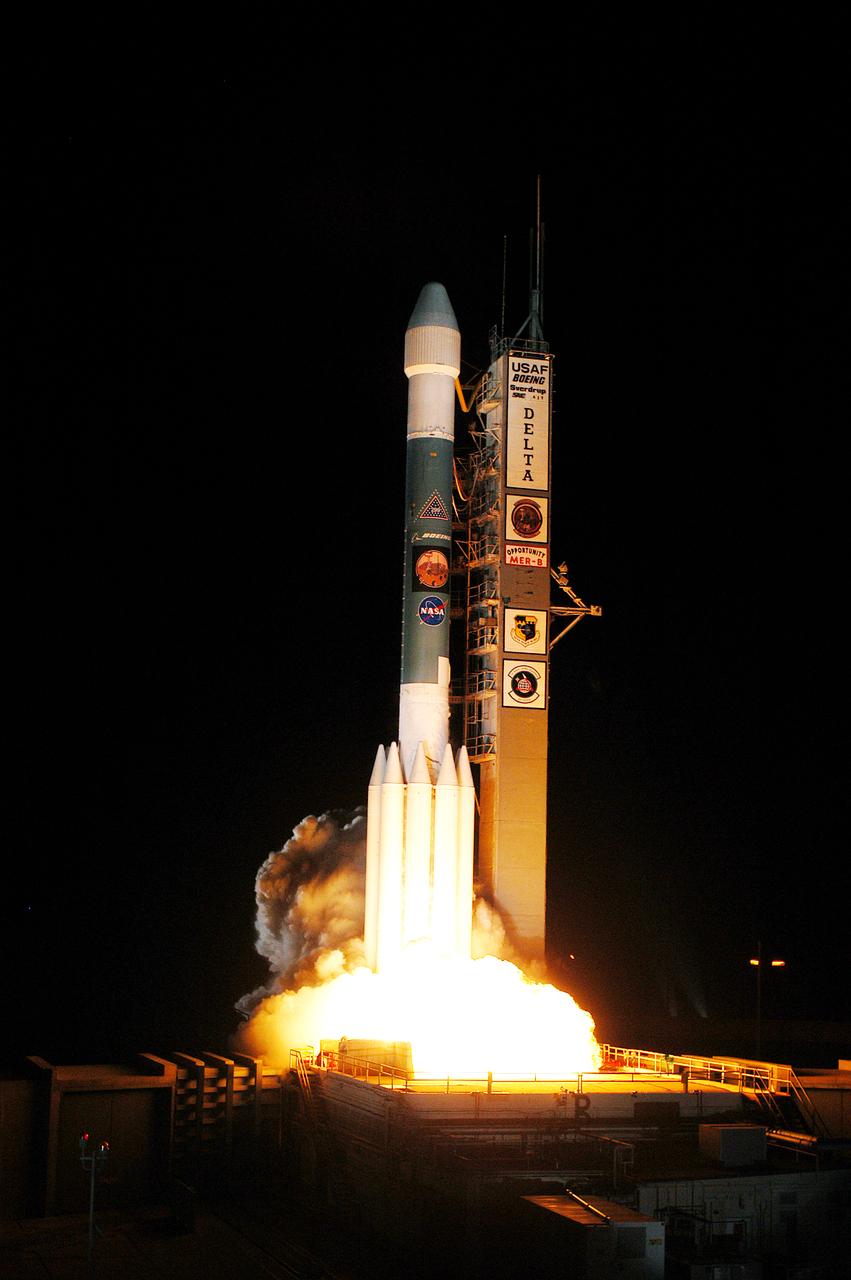 On Launch Complex 17-B, Cape Canaveral Air Force Station, the Delta II Heavy launch vehicle carrying the rover "Opportunity" for the second Mars Exploration Rover mission launches at 11:18:15 p.m. EDT. Opportunity will reach Mars on Jan. 25, 2004. Together the two MER rovers, Spirit (launched June 10) and Opportunity, seek to determine the history of climate and water at two sites on Mars where conditions may once have been favorable to life. The rovers are identical. They will navigate themselves around obstacles as they drive across the Martian surface, traveling up to about 130 feet each Martian day. Each rover carries five scientific instruments including a panoramic camera and microscope, plus a rock abrasion tool that will grind away the outer surfaces of rocks to expose their interiors for examination. Each rover’s prime mission is planned to last three months on Mars.