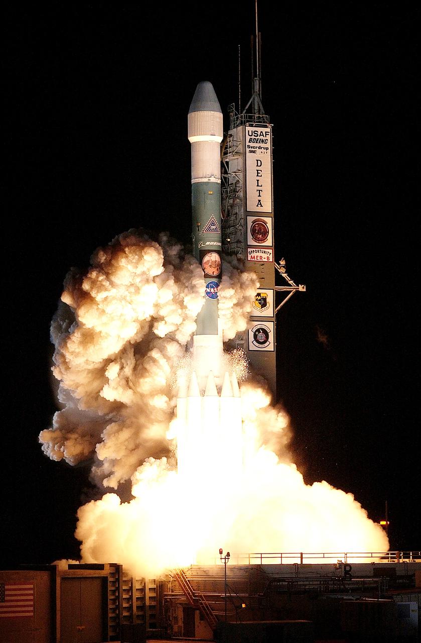 KENNEDY SPACE CENTER, FLA. - On Launch Complex 17-B, Cape Canaveral Air Force Station, the Delta II Heavy launch vehicle carrying the rover "Opportunity" for the second Mars Exploration Rover mission launches at 11:18:15 p.m. EDT. Opportunity will reach Mars on Jan. 25, 2004. Together the two MER rovers, Spirit (launched June 10) and Opportunity, seek to determine the history of climate and water at two sites on Mars where conditions may once have been favorable to life. The rovers are identical. They will navigate themselves around obstacles as they drive across the Martian surface, traveling up to about 130 feet each Martian day. Each rover carries five scientific instruments including a panoramic camera and microscope, plus a rock abrasion tool that will grind away the outer surfaces of rocks to expose their interiors for examination. Each rover’s prime mission is planned to last three months on Mars.
