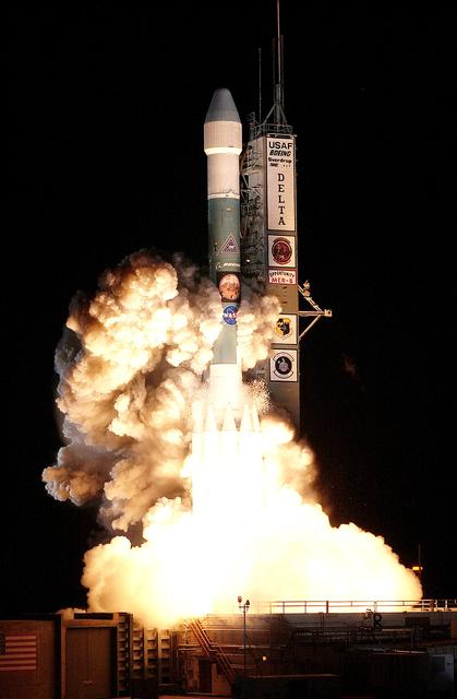 KENNEDY SPACE CENTER, FLA. - On Launch Complex 17-B, Cape Canaveral Air Force Station, the Delta II Heavy launch vehicle carrying the rover "Opportunity" for the second Mars Exploration Rover mission launches at 11:18:15 p.m. EDT.  Opportunity will reach Mars on Jan. 25, 2004. Together the two MER rovers, Spirit (launched June 10) and Opportunity, seek to determine the history of climate and water at two sites on Mars where conditions may once have been favorable to life. The rovers are identical. They will navigate themselves around obstacles as they drive across the Martian surface, traveling up to about 130 feet each Martian day.  Each rover carries five scientific instruments including a panoramic camera and microscope, plus a rock abrasion tool that will grind away the outer surfaces of rocks to expose their interiors for examination. Each rover’s prime mission is planned to last three months on Mars.