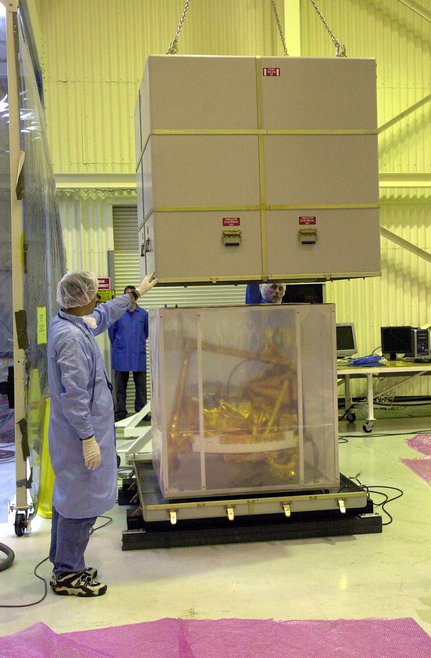 KENNEDY SPACE CENTER, FLA. -  The SciSat-1 spacecraft is uncrated at Vandenberg Air Force Base, Calif.  SciSat-1 weighs approximately 330 pounds and will be placed in a 400-mile-high polar orbit to investigate processes that control the distribution of ozone in the upper atmosphere.  The scientific mission of SciSat-1 is to measure and understand the chemical processes that control the distribution of ozone in the Earth’s atmosphere, particularly at high altitudes.  The data from the satellite will provide Canadian and international scientists with improved measurements relating to global ozone processes and help policymakers assess existing environmental policy and develop protective measures for improving the health of our atmosphere, preventing further ozone depletion.  The mission is designed to last two years.