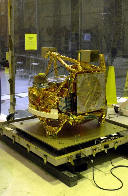 NASA image: KENNEDY SPACE CENTER, FLA. -   The SciSat-1 spacecraft is revealed after being uncrated at Vandenberg Air Force Base, Calif.  SciSat-1 weighs approximately 330 pounds and will be placed in a 400-mile-high polar orbit to investigate processes that control the distribution of ozone in the upper atmosphere.  The scientific mission of SciSat-1 is to measure and understand the chemical processes that control the distribution of ozone in the Earth’s atmosphere, particularly at high altitudes.  The data from the satellite will provide Canadian and international scientists with improved measurements relating to global ozone processes and help policymakers assess existing environmental policy and develop protective measures for improving the health of our atmosphere, preventing further ozone depletion.  The mission is designed to last two years.