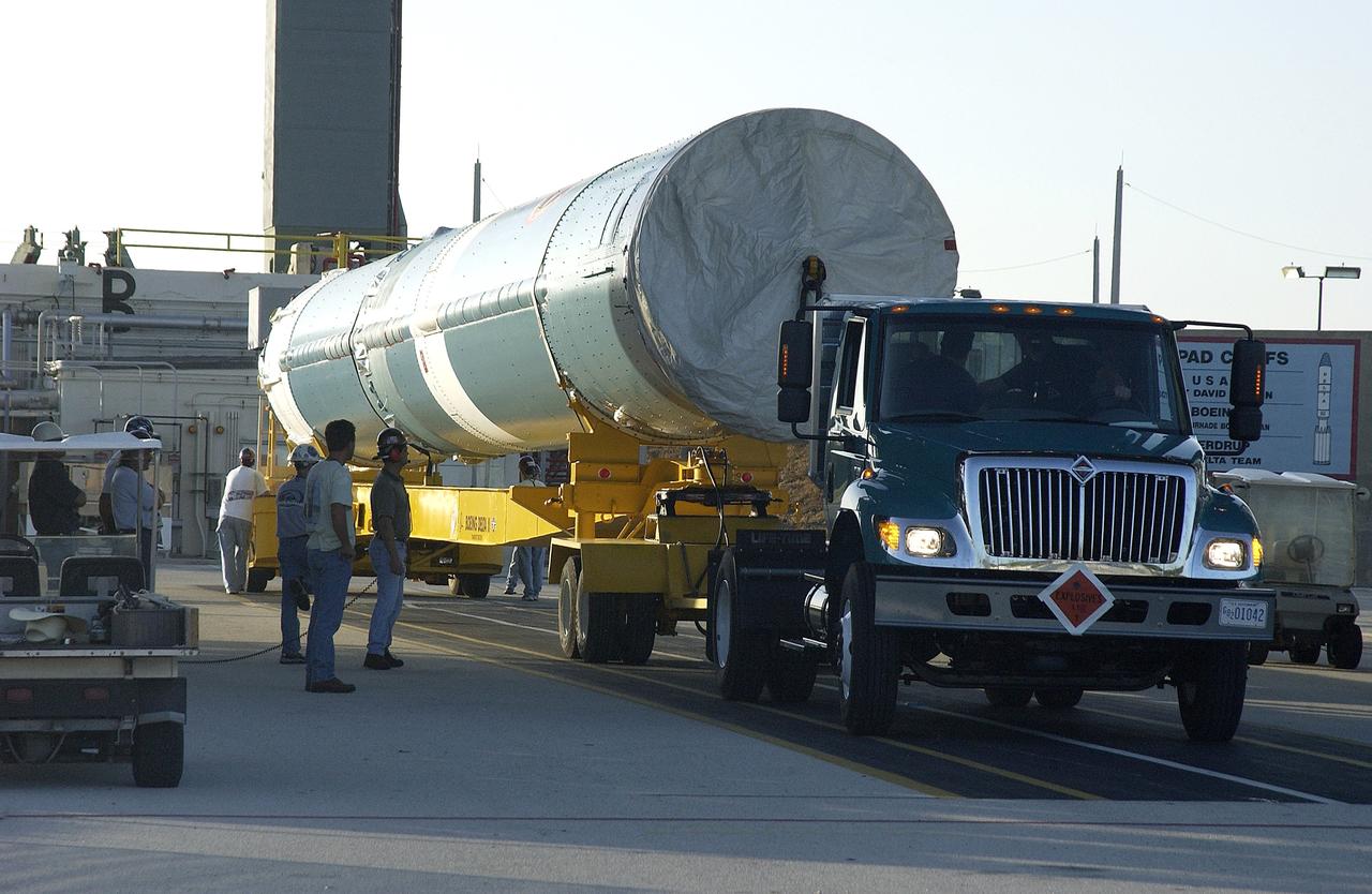 KENNEDY SPACE CENTER, FLA. -   On Launch Complex 17-B, Cape Canaveral Air Force Station, the first stage of a Delta II rocket waits to be lifted up into the mobile service tower.  The rocket is being erected to launch the Space InfraRed Telescope Facility (SIRTF).  Consisting of an 0.85-meter telescope and three cryogenically cooled science instruments, SIRTF is one of NASA's largest infrared telescopes to be launched.  SIRTF will obtain images and spectra by detecting the infrared energy, or heat, radiated by objects in space. Most of this infrared radiation is blocked by the Earth's atmosphere and cannot be observed from the ground.