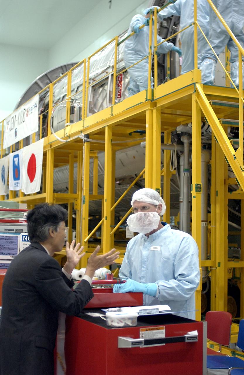 KENNEDY SPACE CENTER, FLA. - STS-115 Mission Specialist Joseph Tanner is dressed in protective gear to enter the Japanese Experiment Module (JEM) Pressurized Module located in the Space Station Processing Facility. Known as Kibo, the JEM consists of six components: two research facilities -- the Pressurized Module and Exposed Facility; a Logistics Module attached to each of them; a Remote Manipulator System; and an Inter-Orbit Communication System unit. Kibo also has a scientific airlock through which experiments are transferred and exposed to the external environment of space. The various components of JEM will be assembled in space over the course of three Space Shuttle missions. The STS-115 mission will deliver the second port truss segment, the P3/P4 Truss, to attach to the first port truss segment, the P1 Truss, as well as deploy solar array sets 2A and 4A.. The crew is scheduled to activate and check out the Solar Alpha Rotary Joint (SARJ) and deploy the P4 Truss radiator.