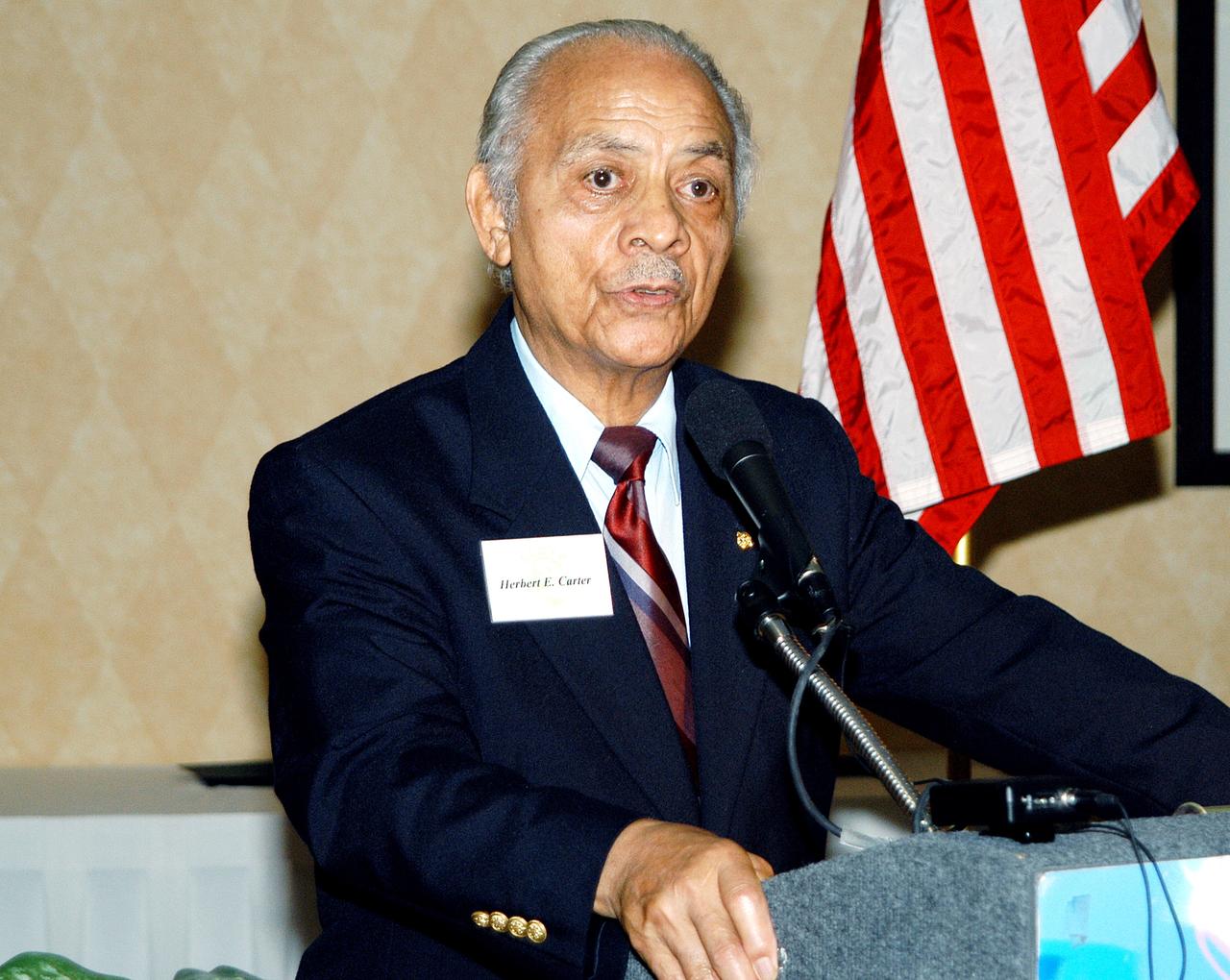 KENNEDY SPACE CENTER, FLA. - Col. (Ret.) Herbert E. Carter, one of the Tuskegee Airmen, speaks to guests at a dinner sponsored by the KSC Spaceflight and Life Sciences Office.