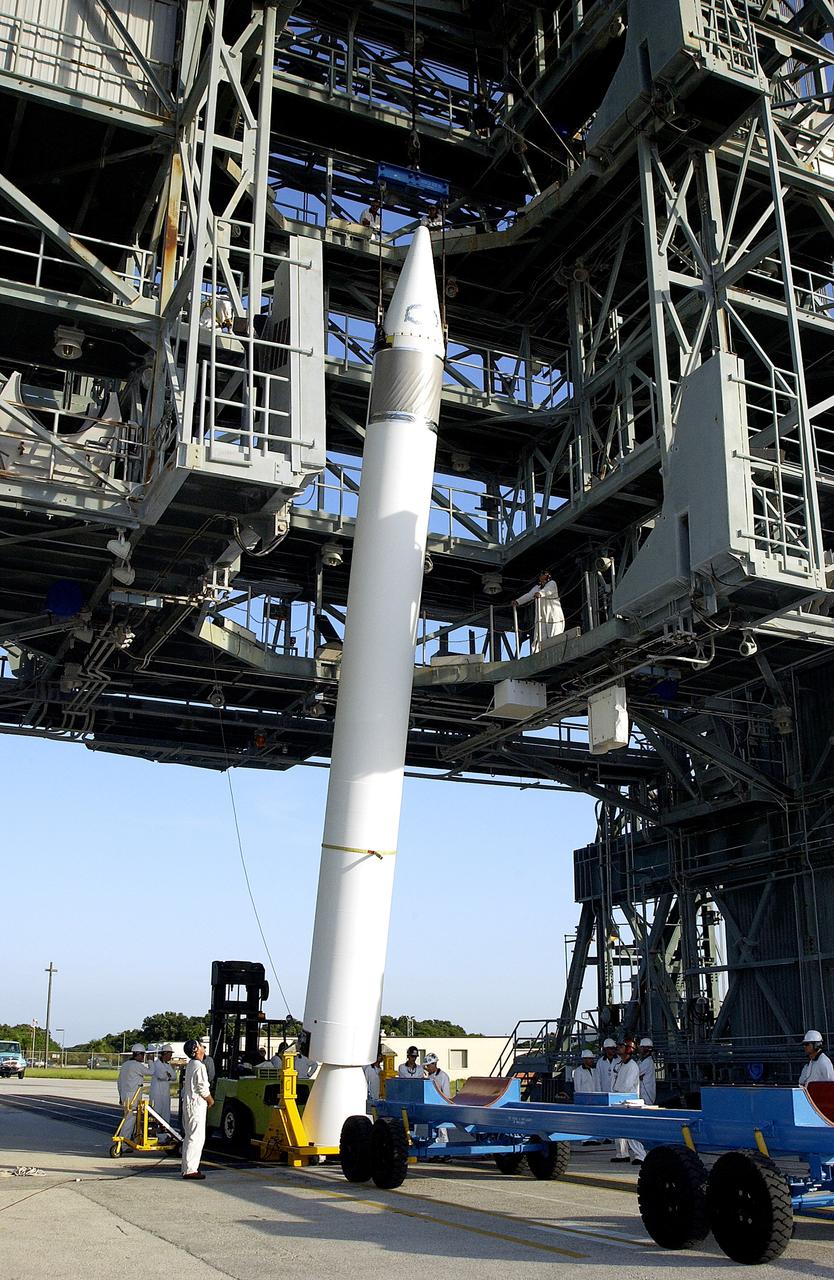 KENNEDY SPACE CENTER, FLA. -   A solid rocket booster (SRB) is lifted to vertical on Launch Complex 17-B, Cape Canaveral Air Force Station. The SRB will be attached to the Delta II Heavy rocket that will launch the Space Infrared Telescope Facility (SIRTF).  The Delta II Heavy features nine 46-inch-diameter, stretched SRBs.  Consisting of three cryogenically cooled science instruments and an 0.85-meter telescope, SIRTF is one of NASA's largest infrared telescopes to be launched.  SIRTF will obtain images and spectra by detecting the infrared energy, or heat, radiated by objects in space. Most of this infrared radiation is blocked by the Earth's atmosphere and cannot be observed from the ground.