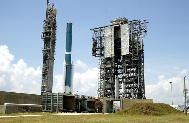NASA image: KENNEDY SPACE CENTER, FLA. -   On Launch Complex 17-B, Cape Canaveral Air Force Station, the Delta II Heavy rocket waits the arrival of the mobile service tower with three additional solid rocket boosters (SRBs).  Nine 46-inch-diameter, stretched SRBs will help launch the Space Infrared Telescope Facility (SIRTF).  Consisting of three cryogenically cooled science instruments and an 0.85-meter telescope, SIRTF is one of NASA's largest infrared telescopes to be launched.  SIRTF will obtain images and spectra by detecting the infrared energy, or heat, radiated by objects in space. Most of this infrared radiation is blocked by the Earth's atmosphere and cannot be observed from the ground.
