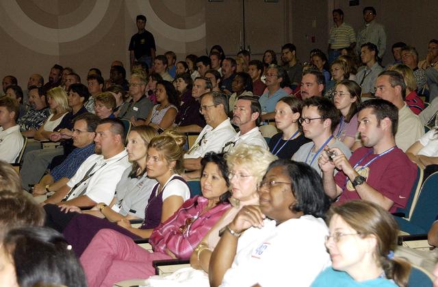 NASA image: KENNEDY SPACE CENTER, FLA. -  KSC employees fill the Training Auditorium to hear comments from Expedition 6 Commander Ken Bowersox about his mission and residence on the International Space Station from November 25, 2002, to May 3, 2003.