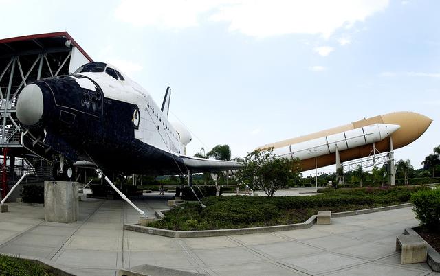 KENNEDY SPACE CENTER, FLA.  -  Featured displays at the KSC Visitor Complex are this full-size replica of a Space Shuttle Orbiter and the genuine solid rocket boosters and external tank, in the Shuttle Plaza.