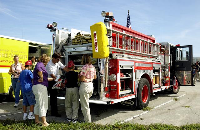 NASA image: KENNEDY SPACE CENTER, FLA.  -  Children enjoy displays of fire equipment during Take Our Children to Work Day.  Employees were invited to share their work experience with their children on this annual event.
