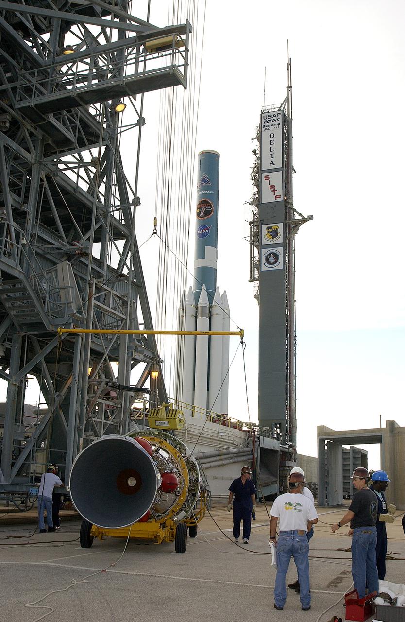 On Launch Complex 17-B, Cape Canaveral Air Force Station, the second stage of the Delta II Heavy rocket is ready to be lifted up the mobile service tower. The rocket will launch the Space Infrared Telescope Facility (SIRTF), currently scheduled for mid-August. SIRTF consists of three cryogenically cooled science instruments and an 0.85-meter telescope, and is one of NASA's largest infrared telescopes to be launched. SIRTF will obtain images and spectra by detecting the infrared energy, or heat, radiated by objects in space. Most of this infrared radiation is blocked by the Earth's atmosphere and cannot be observed from the ground.