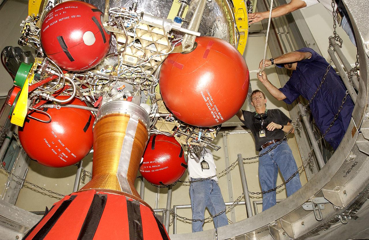 Workers on Launch Complex 17-B, Cape Canaveral Air Force Station, prepare for mating the second stage of the Delta II Heavy rocket to the first stage below. The rocket will launch the Space Infrared Telescope Facility (SIRTF), currently scheduled for mid-August. SIRTF consists of three cryogenically cooled science instruments and an 0.85-meter telescope, and is one of NASA's largest infrared telescopes to be launched. SIRTF will obtain images and spectra by detecting the infrared energy, or heat, radiated by objects in space. Most of this infrared radiation is blocked by the Earth's atmosphere and cannot be observed from the ground.