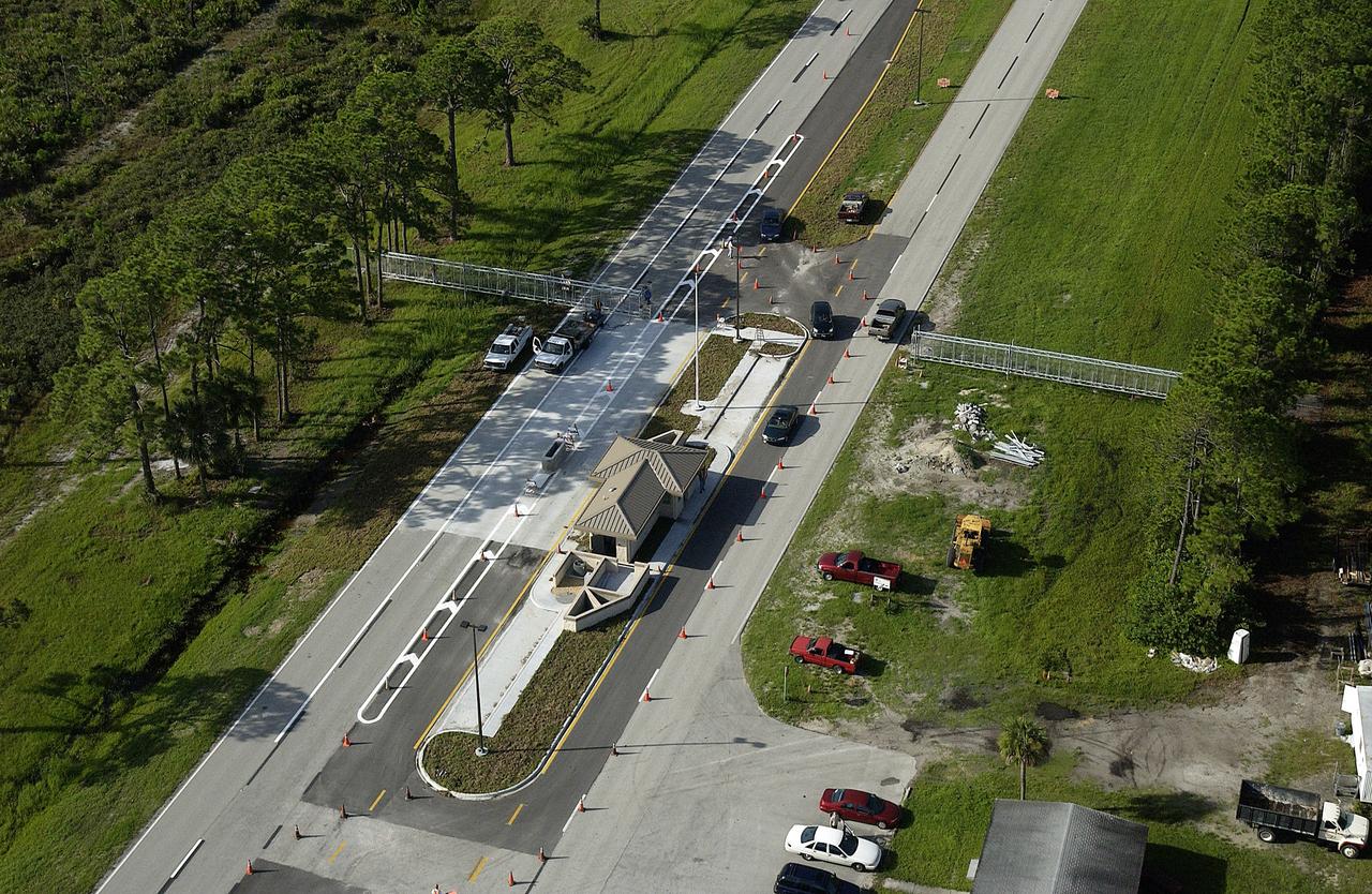 KENNEDY SPACE CENTER, FLA. - Looking south, the new security gate on S.R. 3 is seen from the air.