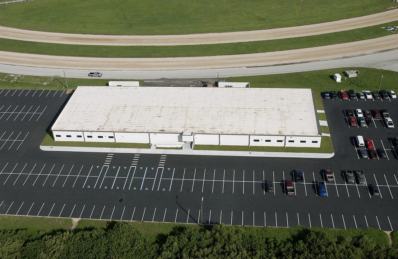 From the air, one of the new Launch Pad facilities building is seen. A mix of office and shop space, the pad facilities consolidate personnel into one site at each pad.