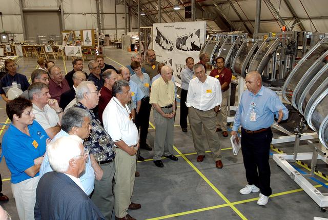 NASA image: KENNEDY SPACE CENTER, FLA.  -  The Stafford-Covey Return to Flight Task Group (SCTG) inspects debris in the Columbia Debris Hangar.   At right is the model of the left wing that has been used during recovery operations.  Chairing the task group are Richard O. Covey, former Space Shuttle commander, and Thomas P. Stafford (third from right, foreground), Apollo commander.  Chartered by NASA Administrator Sean O’Keefe, the task group will perform an independent assessment of NASA’s implementation of the final recommendations by the Columbia Accident Investigation Board.